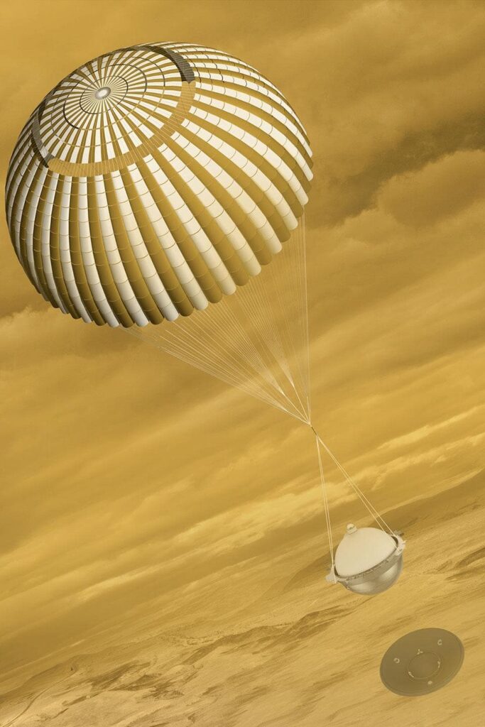 Représentation artistique d'une sonde sphérique descendant vers les montagnes de Vénus à travers une atmosphère nuageuse.
